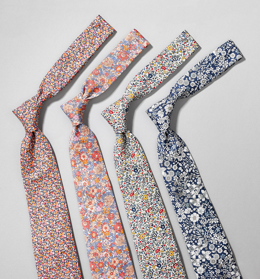 row of four floral ties